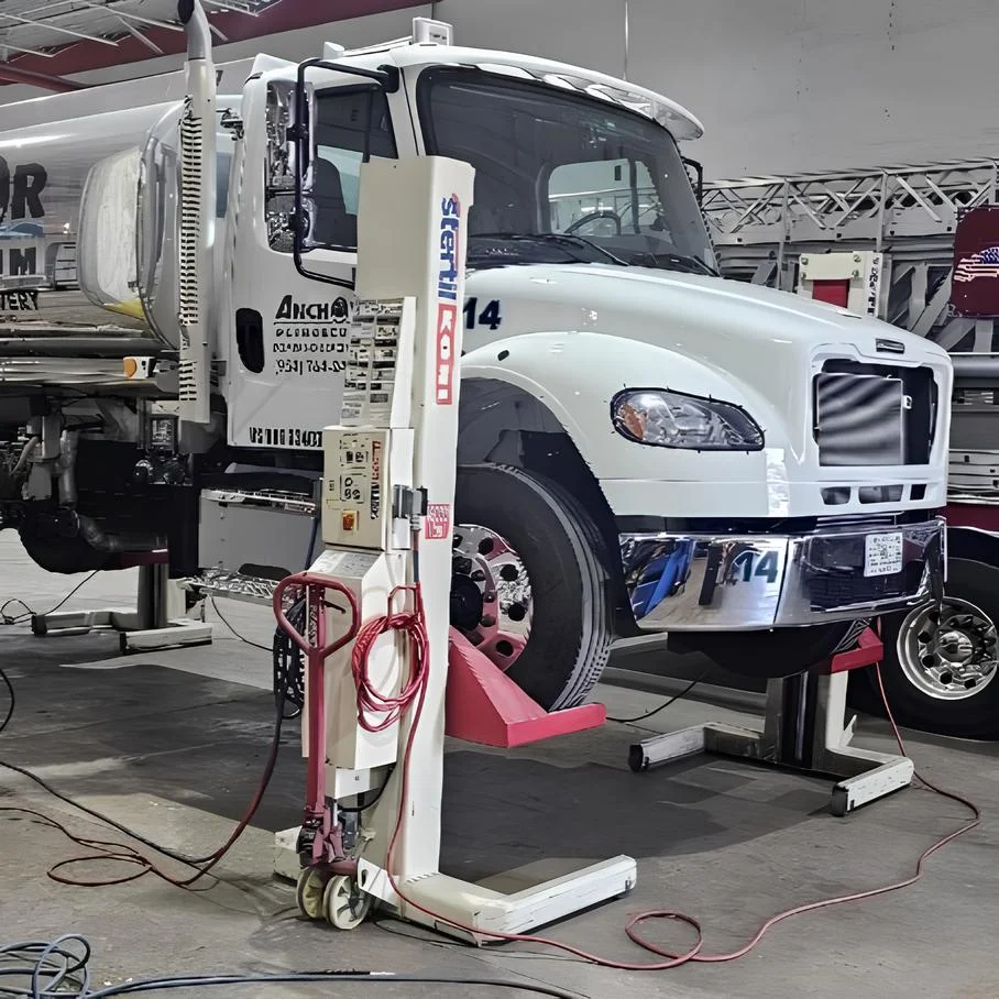 Heavy duty truck raised for wheel alignment