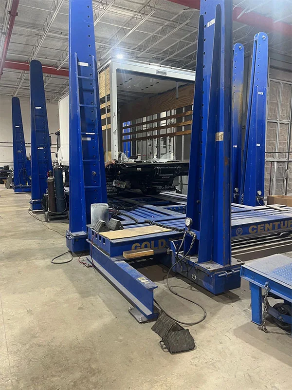 Isuzu box truck body and frame repair at a commercial truck shop in Pompano Beach, FL