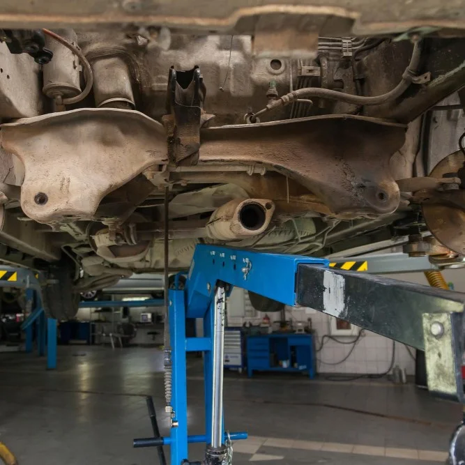 Truck on ramp for exhaust pipe repair
