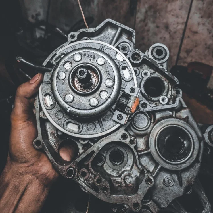 Disassembled engine transmission part