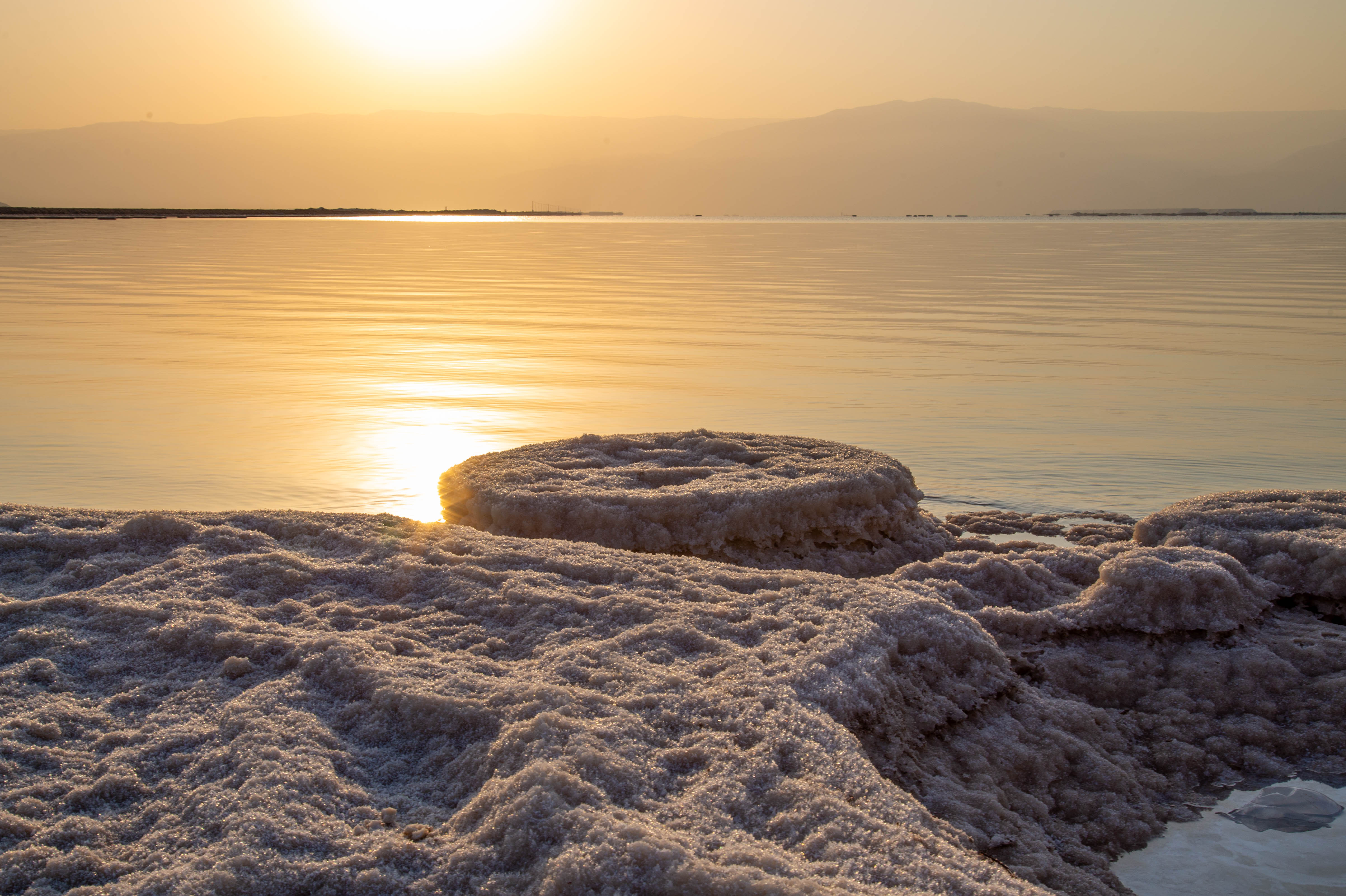 Salt and Sunrise A serene sunrise over the Dead Sea, with crystalline salt formations in the foreground.Dead Sea, Israel